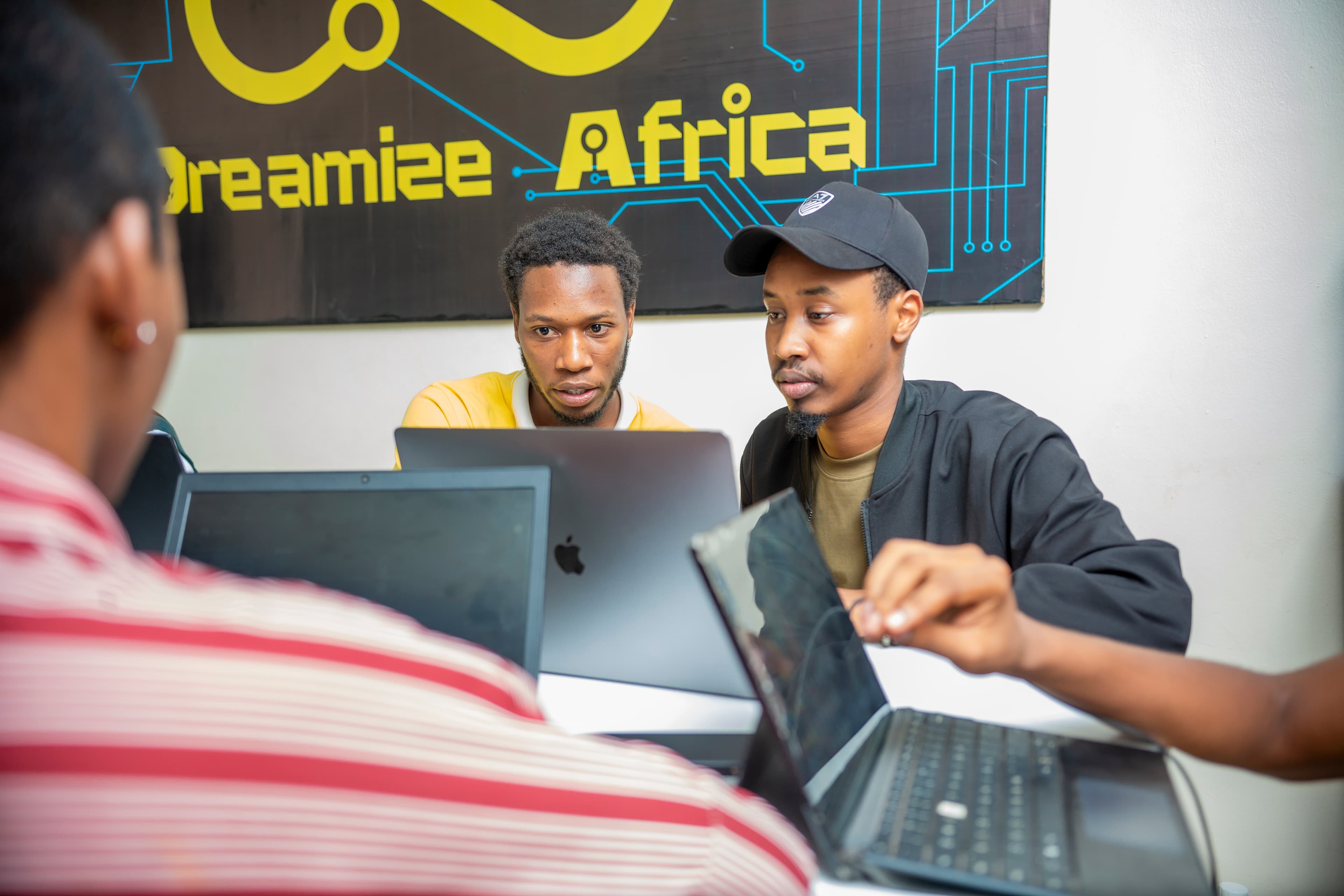 Two students sharing a laptop